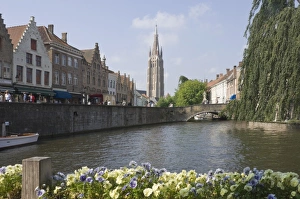 Canal view with the spire of the Church of our Lady, Brugge, Belgium, Europe