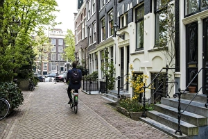 Cyclist Prints: Canalside houses, Amsterdam, Netherlands, Europe