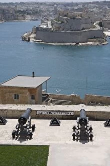 Cannon in Barracca Gardens, Fort St Angelo in Vittoriosa across the water