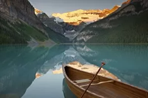 Images Dated 21st August 2011: Canoe on Lake Louise at sunrise, Banff National Park, UNESCO World Heritage Site, Alberta
