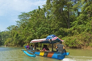 Canoe on river trip to the popular Green Canyon beauty spot, near the south coast, Cijulang River, Pangandaran, Java, Indonesia, Southeast Asia, Asia Canoe on river trip to the popular Green Canyon beauty spot, near the south coast, Cijulang River, Pangandaran, Java, Indonesia, Southeast Asia, Asia