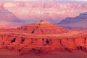 Canyonlands Prints: Canyon view in Canyonlands Utah showcases layered rock formations and distant cliffs during sunrise hours