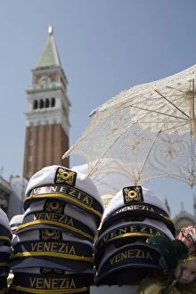 Captains hats and sun umbrellas for sale in St. Marks Square