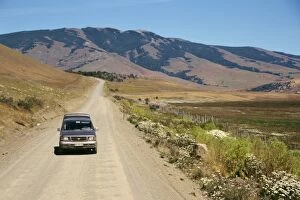 Rural Road Collection: Car driving on a dirt road in Patagonia, Chile, South America