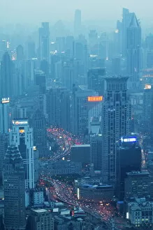 Congestion Collection: Car light trails and illuminated buildings leading from the Bund, Shanghai, China, Asia