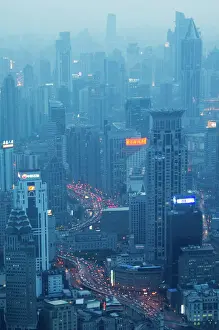 Illuminating Prints: Car light trails and illuminated buildings leading from the Bund, Shanghai, China, Asia