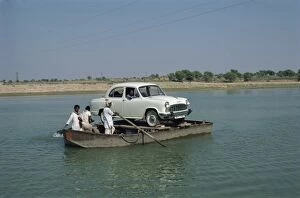 Car on rowboat ferry in Rajasthan state, India, Asia