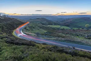Car trail lights near Curbar Edge at dusk, Derbyshire, Peak District National Park