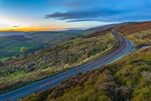 Car trail lights near Curbar Edge at dusk, Derbyshire, Peak District National Park