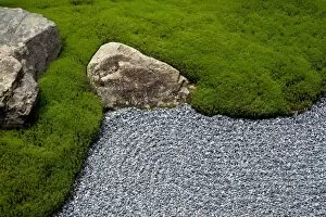 Carefully manicured moss highlights a rock garden at Sanzenin Temple in Ohara