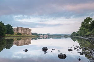 Fortification Gallery: Carew Castle reflected in the mill pond at dawn, Pembrokeshire, Wales, United Kingdom