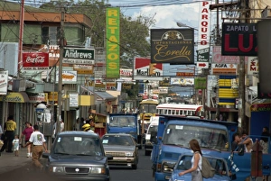 Cars and signs in main street, Heredia, Central Valley, Costa Rica, Central America