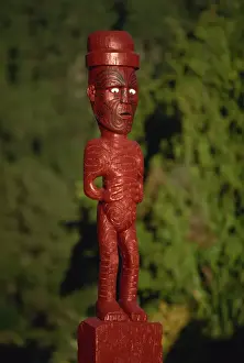Whakarewarewa Prints: A carved figure or poupou in a Maori village at the Whakarewarewa thermal