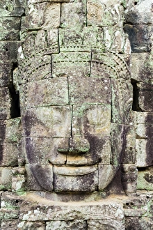 Carved stone faces at Prasat Bayon temple ruins, Angkor Thom, UNESCO World Heritage Site