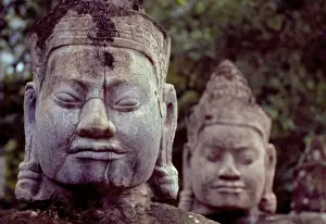Religious Icon Prints: Carved stone statues aligned at South Gate to Angkor Thom