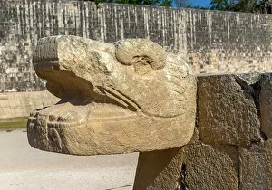 Mesoamerica Prints: Carved stonework jaguar head with walls of the ball court