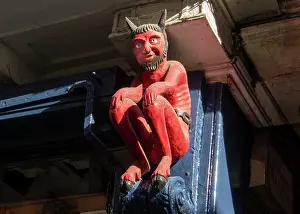 Symbolism Prints: Carving of the Stonegate Devil located above entrance of historic building in York from the 17th century