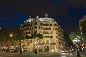 Antoni Gaudi Prints: Casa Mila (La Pedrera), by Antoni Gaudi at dusk, Passeig de Gracia, Barcelona