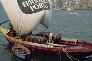 River Douro Prints: Casks of port on a barge on the Douro River in Porto