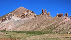 Afghanistan Prints: Castle Gorgaheen stands on a hillside in the Bamiyan region of Afghanistan surrounded by open land and clear skies