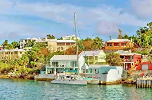 Catamaran Prints: Catamaran in The Great Sound, moored in front of typical pastel coloured properties