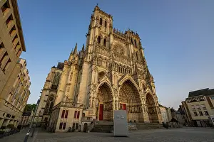 Worship Prints: Cathedral of Amiens showcases detailed architecture in evening light near a quiet square in France