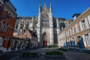 Windows Prints: Cathedral of Amiens stands tall amid buildings under clear sky in France