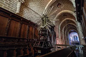 Worship Prints: Cathedral of Vora shows altar with wooden details and stone walls from interior view in Evora