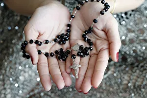 Adults Prints: Catholic woman praying rosary beads and crucifix, Vietnam, Indochina, Southeast Asia
