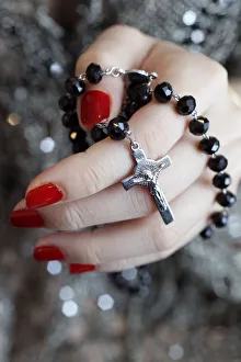 Catholic woman praying rosary beads and crucifix, Vietnam, Indochina, Southeast Asia