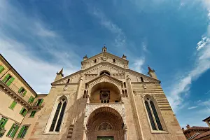 Piazza Prints: Cattedrale Santa Maria Matricolare stands tall in Piazza Duomo with blue sky in the background in Verona