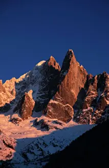 Alps Prints: The celebrated peak of the Aiguille du Dru stands high above the village of Argentiere