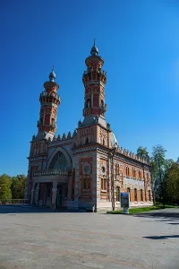 Gardens Prints: Central mosque stands in Vladikavkaz showcasing its unique architecture and design against a blue sky in North Ossetia