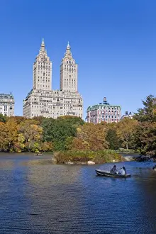Central Park Prints: Central Park and the Grand buildings along Central Park West viewed across the lake in autumn
