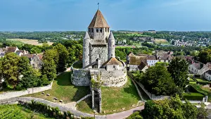 Observation Prints: Cesar tower stands tall amid green fields and historic buildings in Provins, France