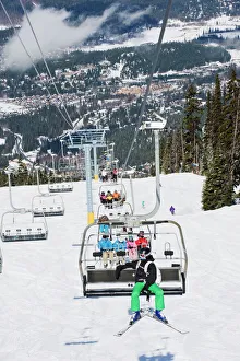Images Dated 31st March 2009: Chairlift with skiers, Whistler mountain resort, venue of the 2010 Winter Olympic Games
