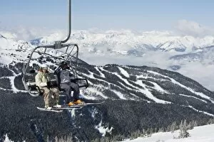 Images Dated 31st March 2009: Chairlift with skiers, Whistler mountain resort, venue of the 2010 Winter Olympic Games