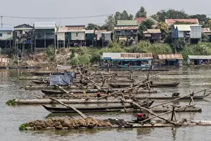 Cham people using a Dai fishing system for trei real fish on the Tonle Sap River