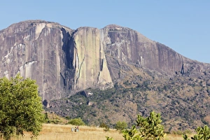 Ambalavao Prints: Chameleon Peak with local women on a trail, Tsaranoro Valley, Ambalavao, central area