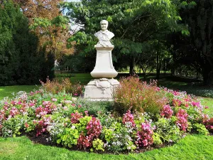 Charm Prints: Charles Augustin Sainte Beuve statue in the garden surrounded by flowers in Luxembourg Gardens