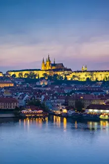 Charles Bridge and Prague Castle, UNESCO World Heritage Site, across the Vltava River at dusk