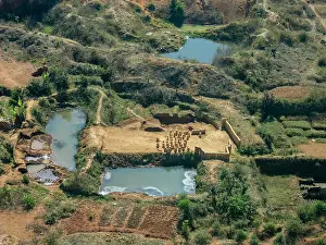 Economy Prints: Charter flight over brickworks along river in Madagascar showcasing local craftsmanship in a rural setting