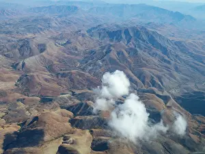Altitude Prints: Charter flight over dry landscapes in Madagascar with clouds