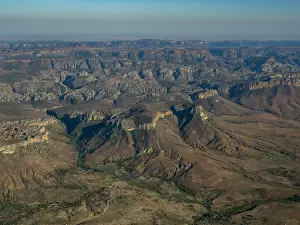 Altitude Prints: Charter flight over landscapes from Isalo National Airport to Antanavarino Charter Flight Base in Madagascar showcasing