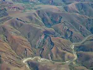 Altitude Prints: Charter flight revealing the route of a river through mountains in Madagascar from Antanavarino to Anjajavy Private