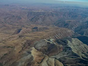 Uninhabited Prints: Charter flight traverses dry landscapes from Isalo National Airport to Antanavarino Charter Flight Base in Madagascar
