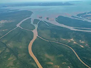 Ecology Prints: Charter flight view of a river flowing into the sea in Madagascar