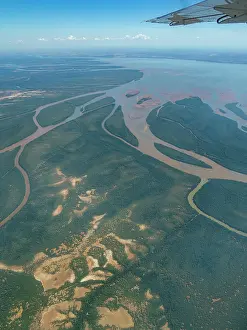 Madagascar Prints: Charter flight view of river flowing into the sea near Madagascar