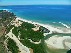 Ecosystems Prints: Charter flight view of a river leading to the sea in Madagascar near Anjajavy Private Reserve
