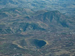 Altitude Prints: Charter flight views over a village in Madagascar showcasing landscape and terrain from Isalo National Airport
